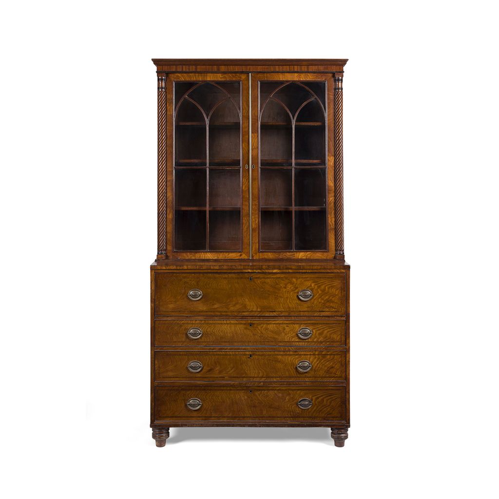 Appraisal: REGENCY FIGURED MAHOGANY BOOKCASE CIRCA the moulded cornice above a