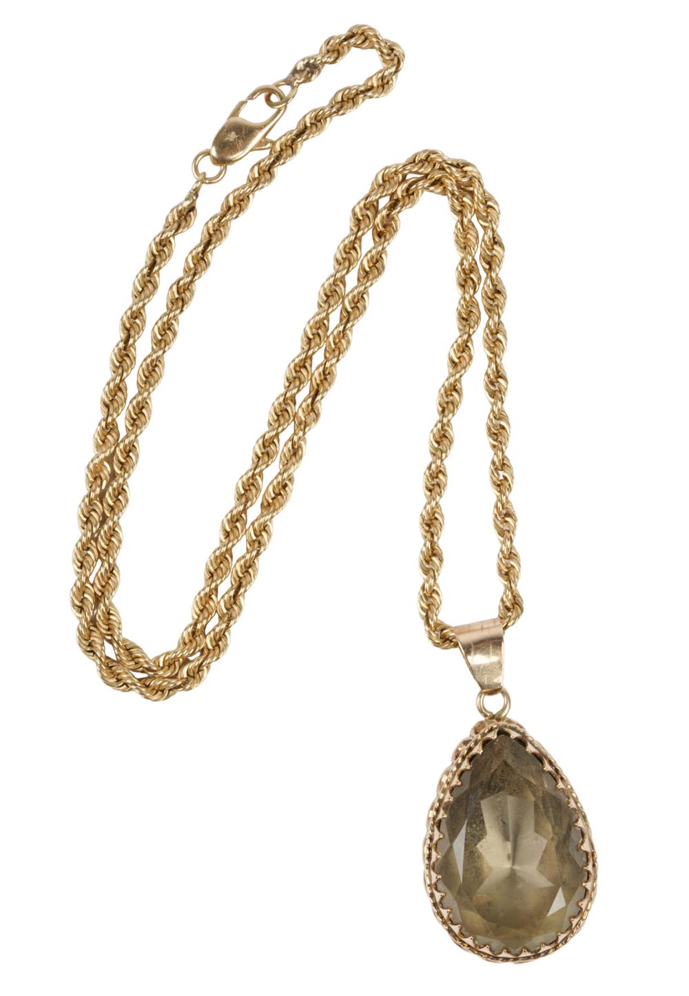 Appraisal: KARAT YELLOW GOLD SMOKY QUARTZ NECKLACEcentering one pear mixed cut