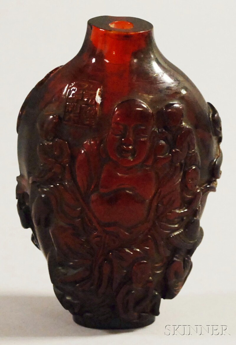 Appraisal: Chinese Carved Amber Snuff Bottle each side with depictions of