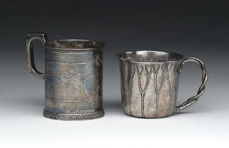 Appraisal: TWO SILVER MUGS - h handled cylindrical mug hallmarked on