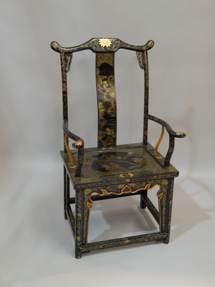 Appraisal: A Chinese armchair painted in gold lacquer with landscapes etc