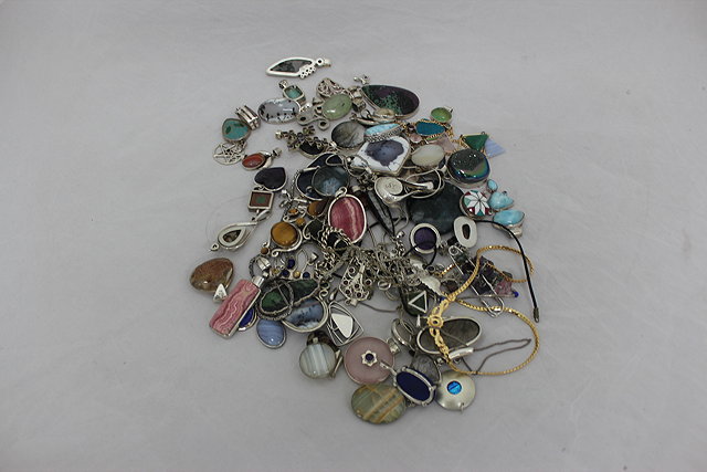 Appraisal: A COLLECTION OF CONTEMPORARY SILVER SEMI PRECIOUS STONE MOUNTED PENDANTS