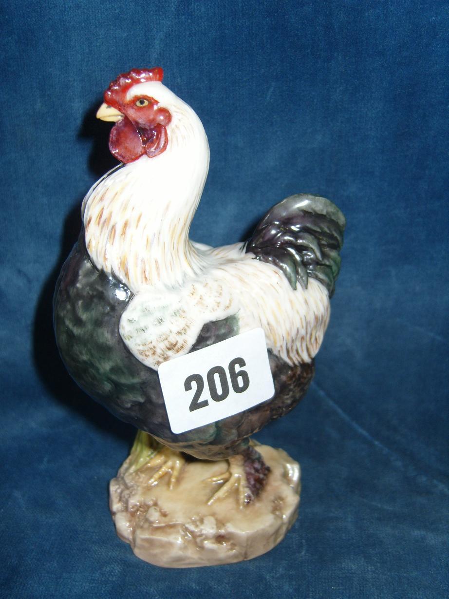 Appraisal: A Royal Worcester model of a cockerel with dark green