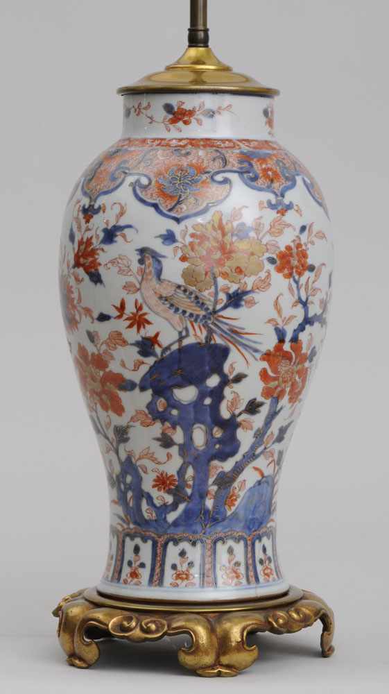 Appraisal: JAPANESE IMARI PORCELAIN BALUSTER-FORM VASE ON GILT-METAL LAMP BASE Decorated