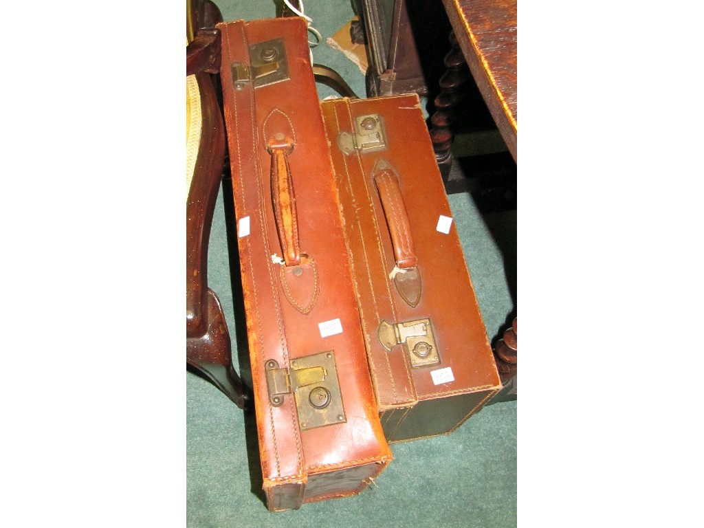 Appraisal: Lot comprising two leather suitcases