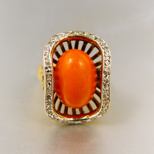 Appraisal: K CORAL AND DIAMOND RING K yellow gold ring with