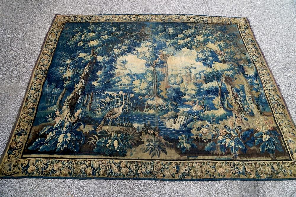 Appraisal: A Flemish Verdure Tapestry- thc Woven with a leafy forest