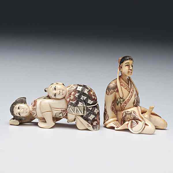 Appraisal: Japanese Erotic Netsukes Japanese two carved and inked erotic netsukes