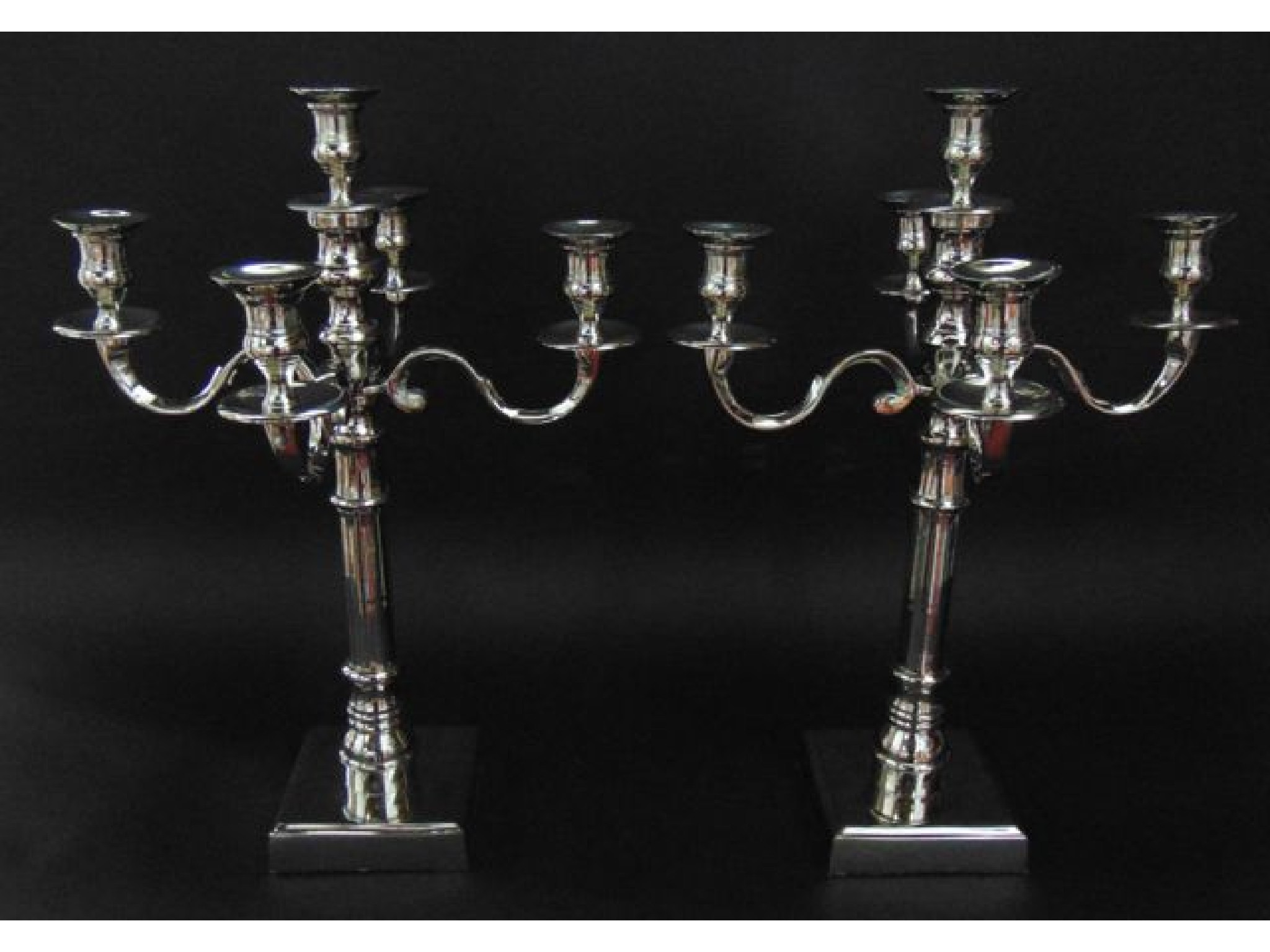 Appraisal: A pair of five branch contemporary nickel plated candelabra raised