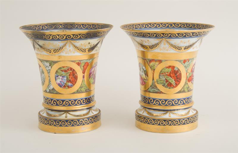 Appraisal: PAIR OF CONTINENTAL PORCELAIN BEAKER-FORM JARDINI RES AND STANDS The