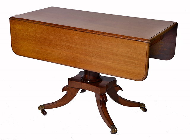 Appraisal: A REGENCY MAHOGANY PEDESTAL PEMBROKE TABLE with drop flaps splay