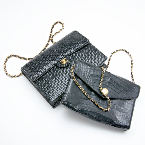 Appraisal: Two Chanel day bags both black with drop-in interwoven chains