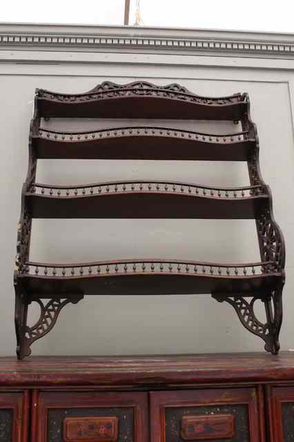 Appraisal: A SET OF MAHOGANY SERPENTINE FRONTED HANGING WALL SHELVES each