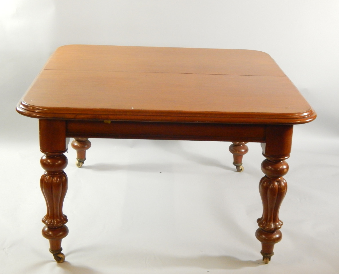 Appraisal: A Victorian mahogany wind out dining table with baluster carved