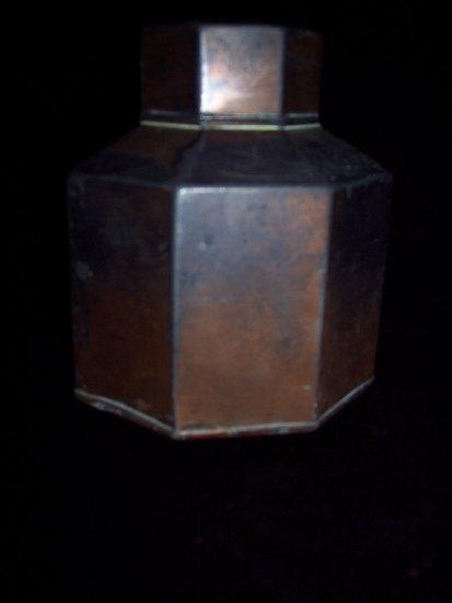 Appraisal: An octagonal copper tea caddy and cover cm high