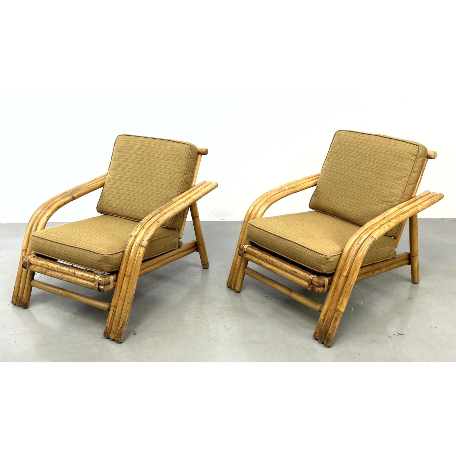 Appraisal: Pr Triple Band Rattan Lounge Chairs Cushion Back and Seat