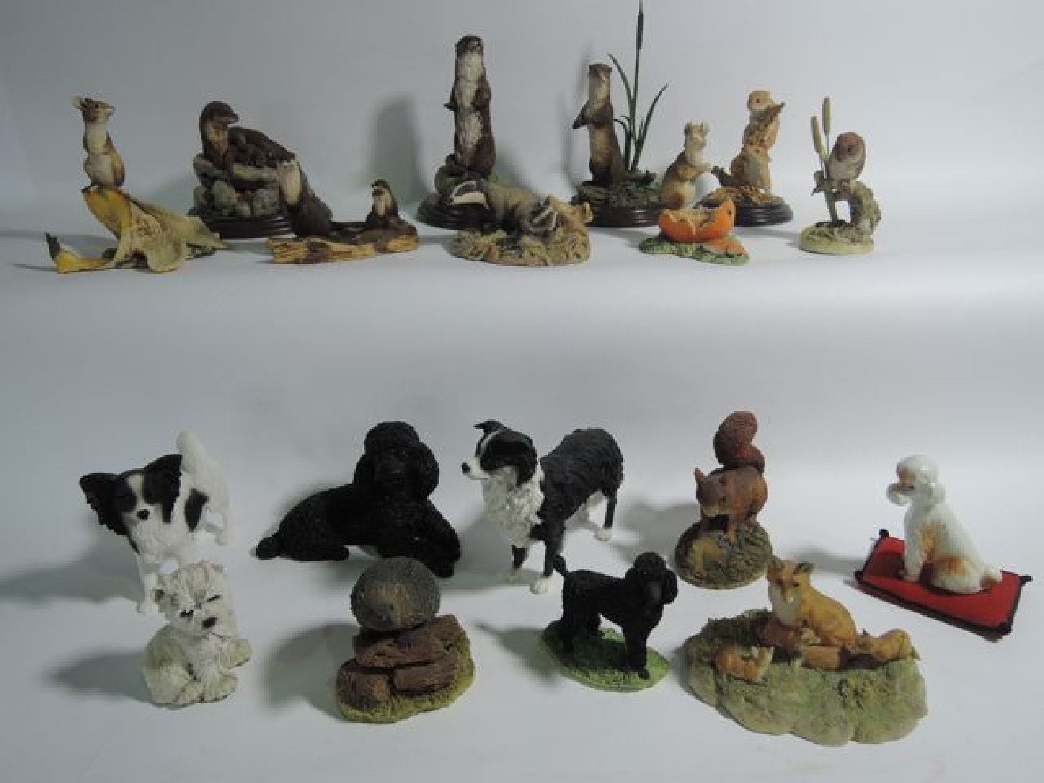 Appraisal: A collection of cast resin animal groups including examples showing