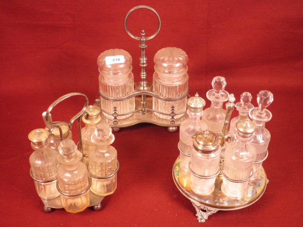 Appraisal: A silver plated cruet stand with cut glass bottles another