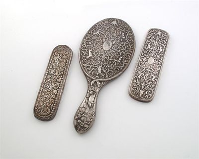 Appraisal: Indian silver a late th century hand mirror profusely decorated