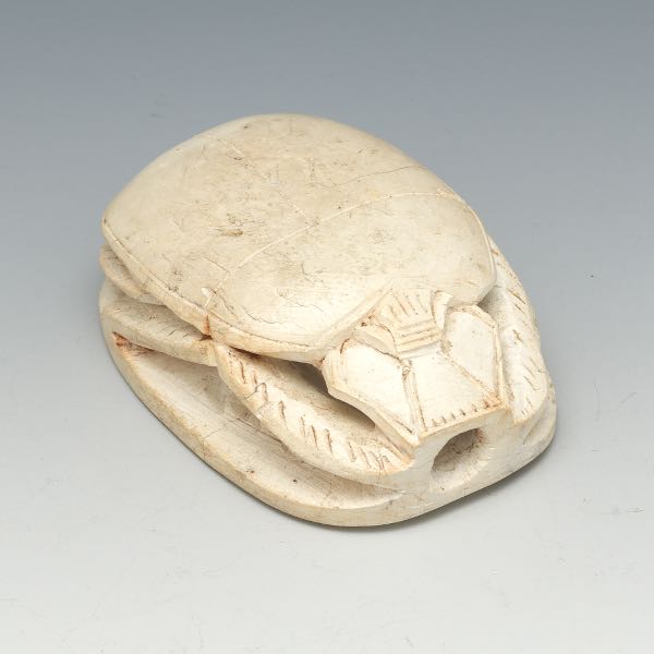 Appraisal: EGYPTIAN LIMESTONE CARVED SCARAB CA TH CENTURY x x Traditionally