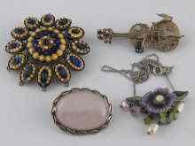 Appraisal: A mixed lot comprising an enamel brooch set on white