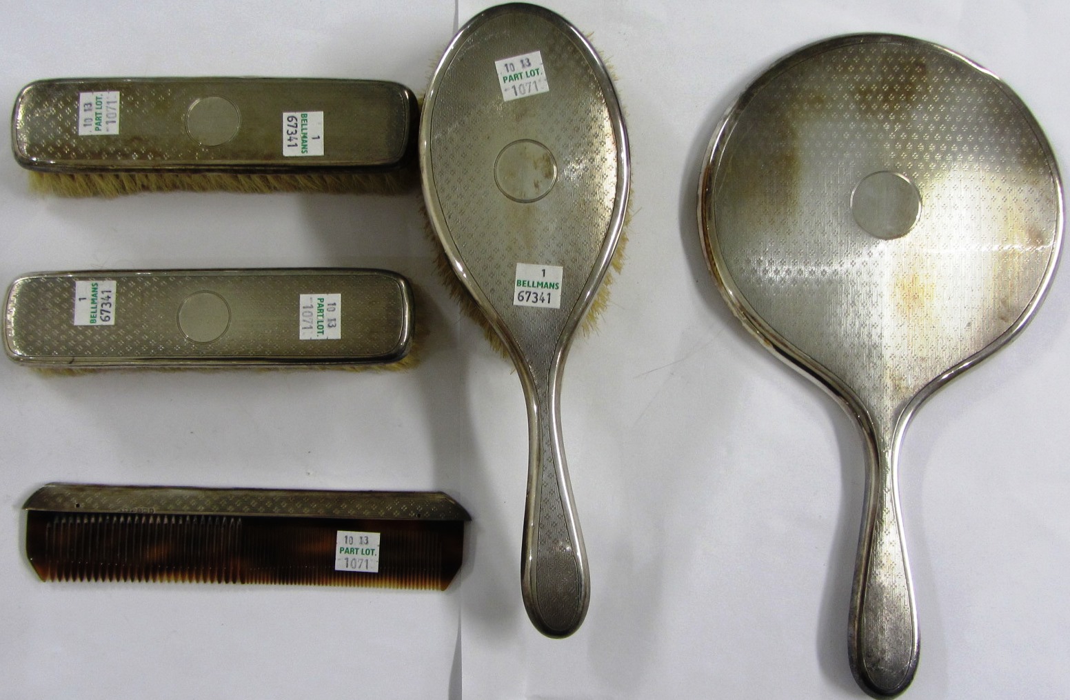 Appraisal: A silver mounted four piece composite dressing set comprising a