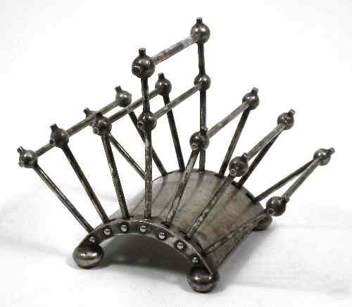 Appraisal: A late Victorian plated six division toast or letter rack