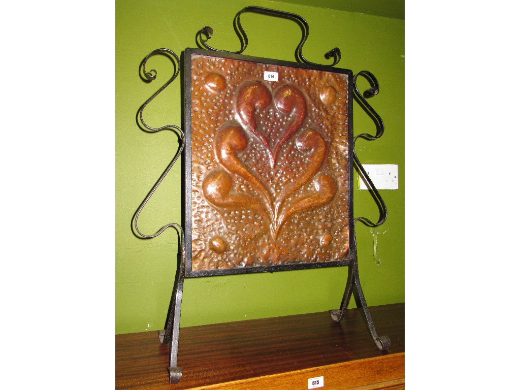 Appraisal: Hammered copper and cast iron firescreen