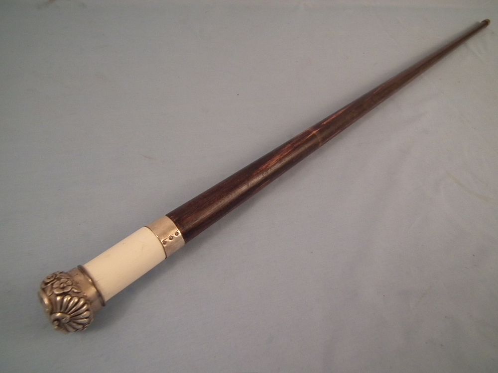 Appraisal: RARE ANTIQUE WHISTLE CANE A rare antique sailor made cane