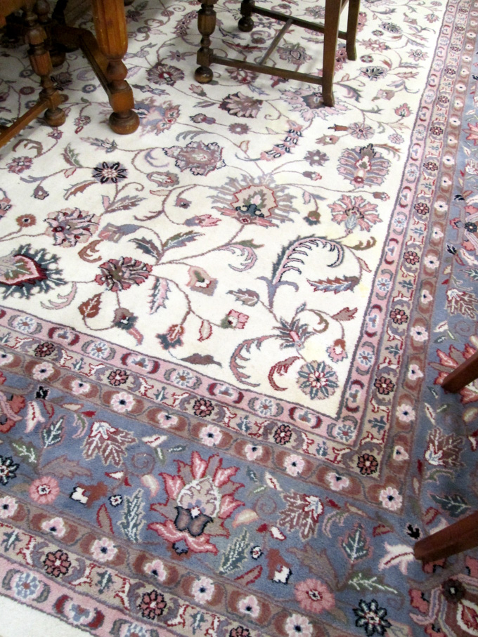 Appraisal: HAND KNOTTED ORIENTAL CARPET Indo-Persian overall floral design on cream