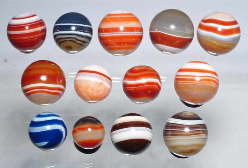 Appraisal: Lot of Bulls Eye Agate Marbles Description Nice group including