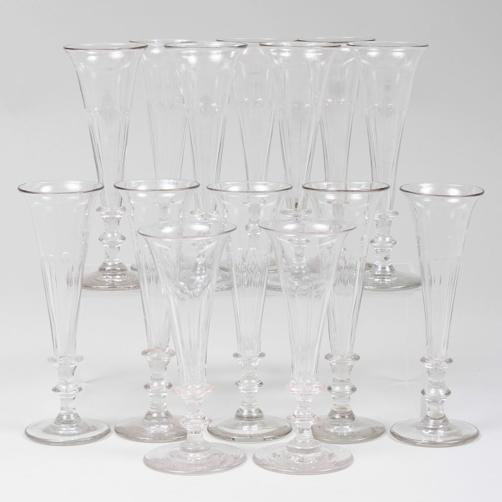 Appraisal: Group of Fourteen English Glass Flutes in high Condition The