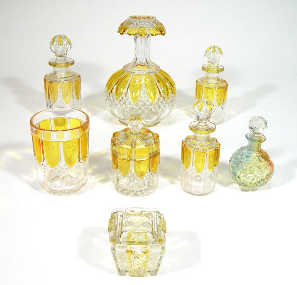 Appraisal: Amber flashed glass part dressing table set comprised three graduated