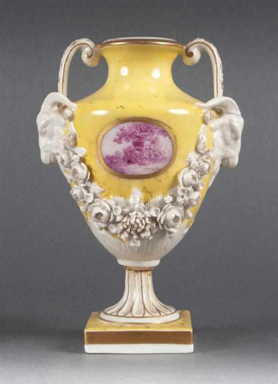 Appraisal: French porcelain double handled urn with applied decoration th century