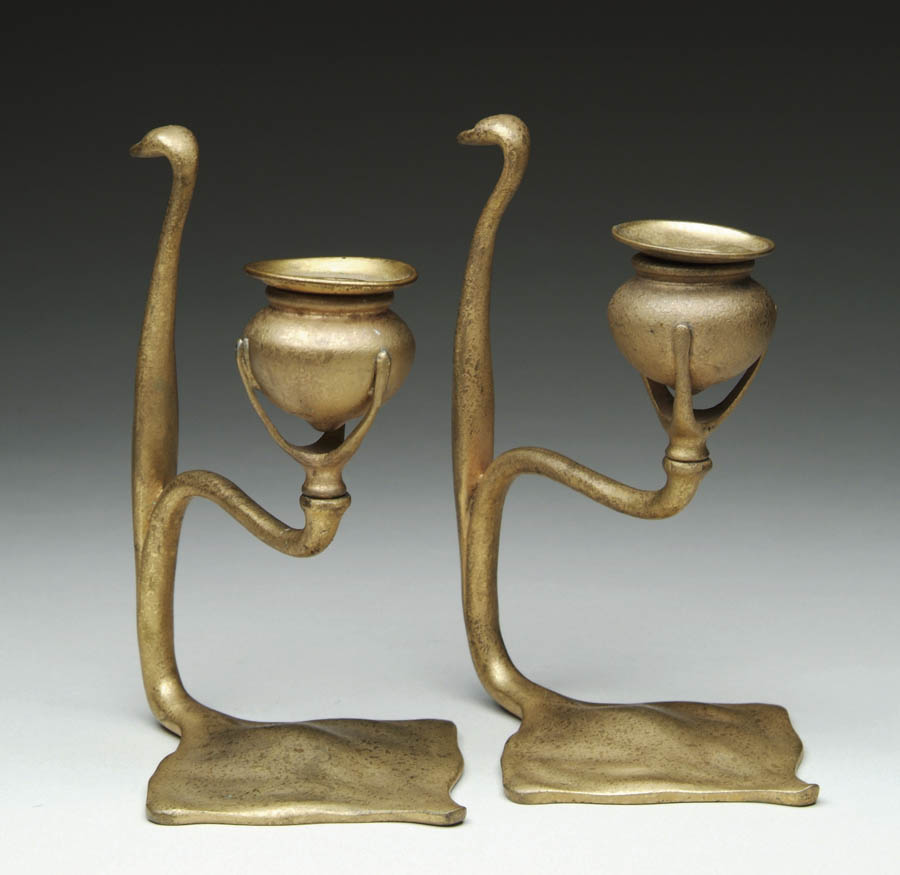 Appraisal: PAIR OF SIGNED TIFFANY CANDLESTICKS IN THE COBRA DESIGN Bronze