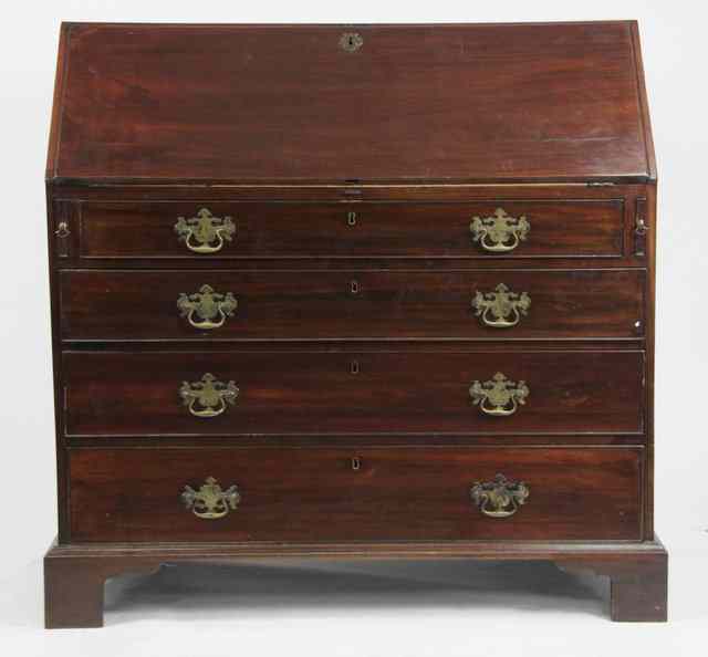 Appraisal: A George III mahogany bureau the fall front enclosing a