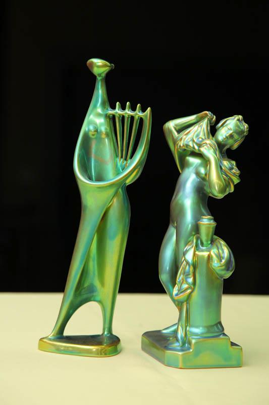 Appraisal: TWO ZSOLNAY FIGURES Both green iridescent A woman disrobing h