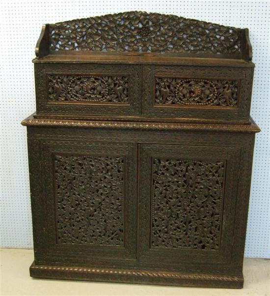 Appraisal: Twentieth century Burmese hardwood carved sideboard the top with raised