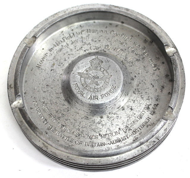 Appraisal: AN ALUMINIUM CIRCULAR ASHTRAY constructed from a Merlin engine piston