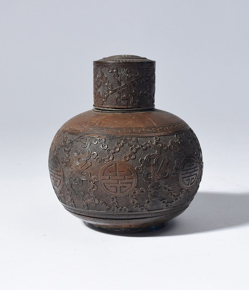 Appraisal: Carved and silver lined Chinese coconut tea caddy Carved and