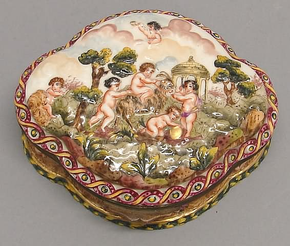 Appraisal: Quatrefoil form with putti in landscape in bas relief t