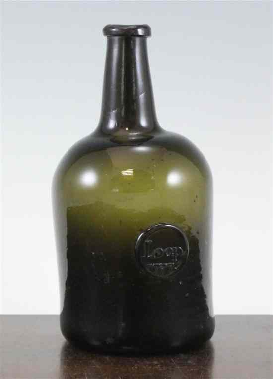 Appraisal: A black glass sealed wine bottle c of cylindrical form