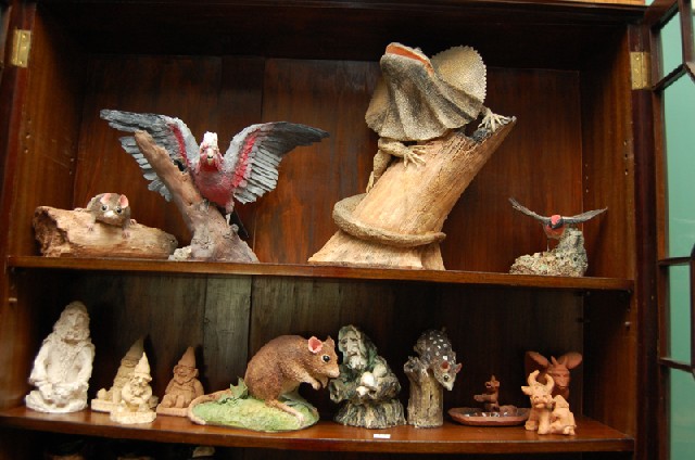 Appraisal: TWO SHELVES OF CONTEMPORARY POTTERY FIGURES Including Australian marsupials dwarves