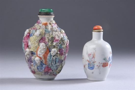 Appraisal: TWO CHINESE FAMILLE ROSE SNUFF BOTTLES th century One molded