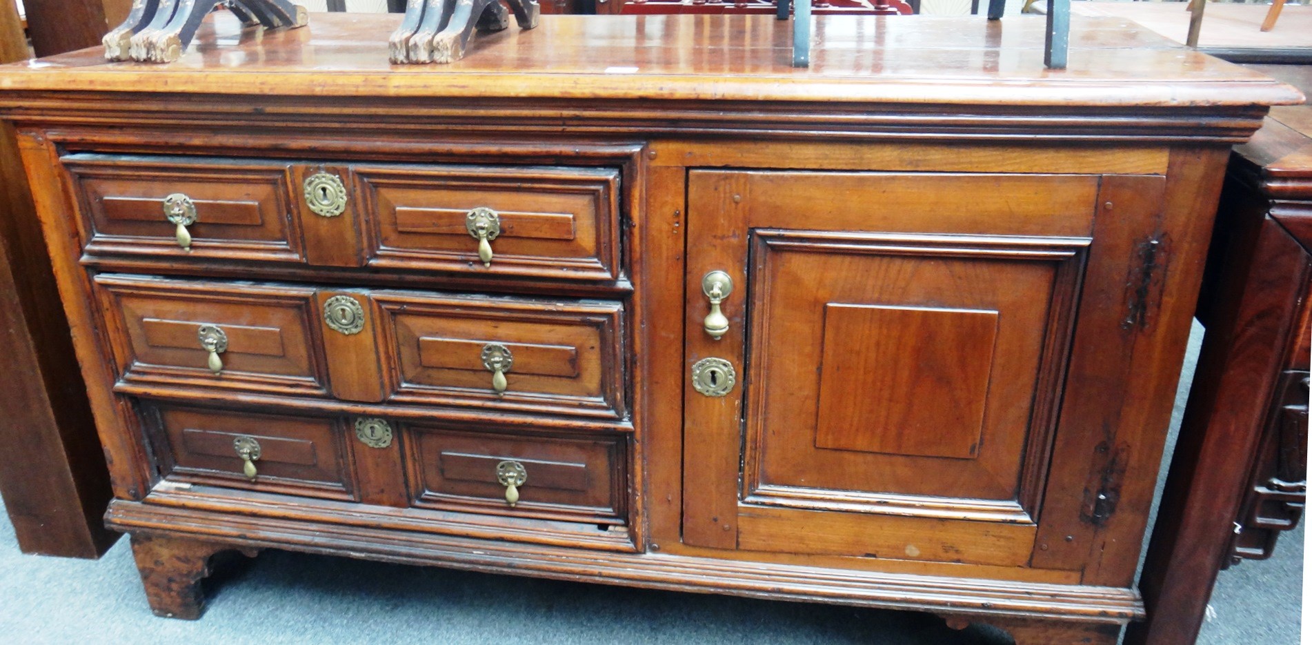 Appraisal: A th century continental walnut side cabinet with three drawers