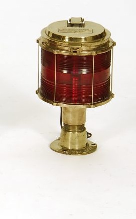 Appraisal: BRASS PIER LIGHT With red Fresnel lens Hinged top Highly