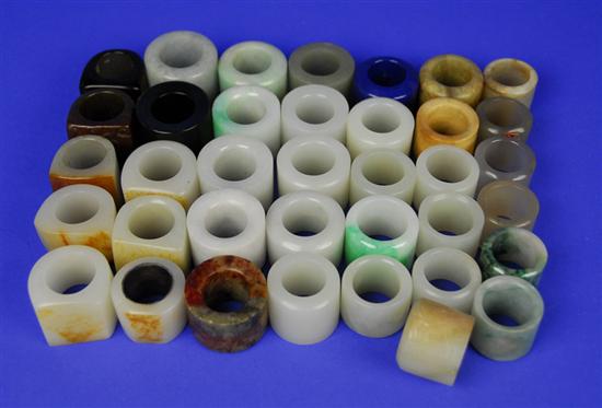 Appraisal: COLLECTION OF THIRTY SEVEN CHINESE CARVED HARDSTONE ARCHER'S RINGS Condition