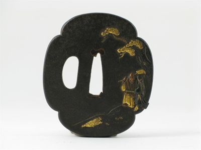 Appraisal: A Japanese iron tsuba applied with gold depicting an elderly