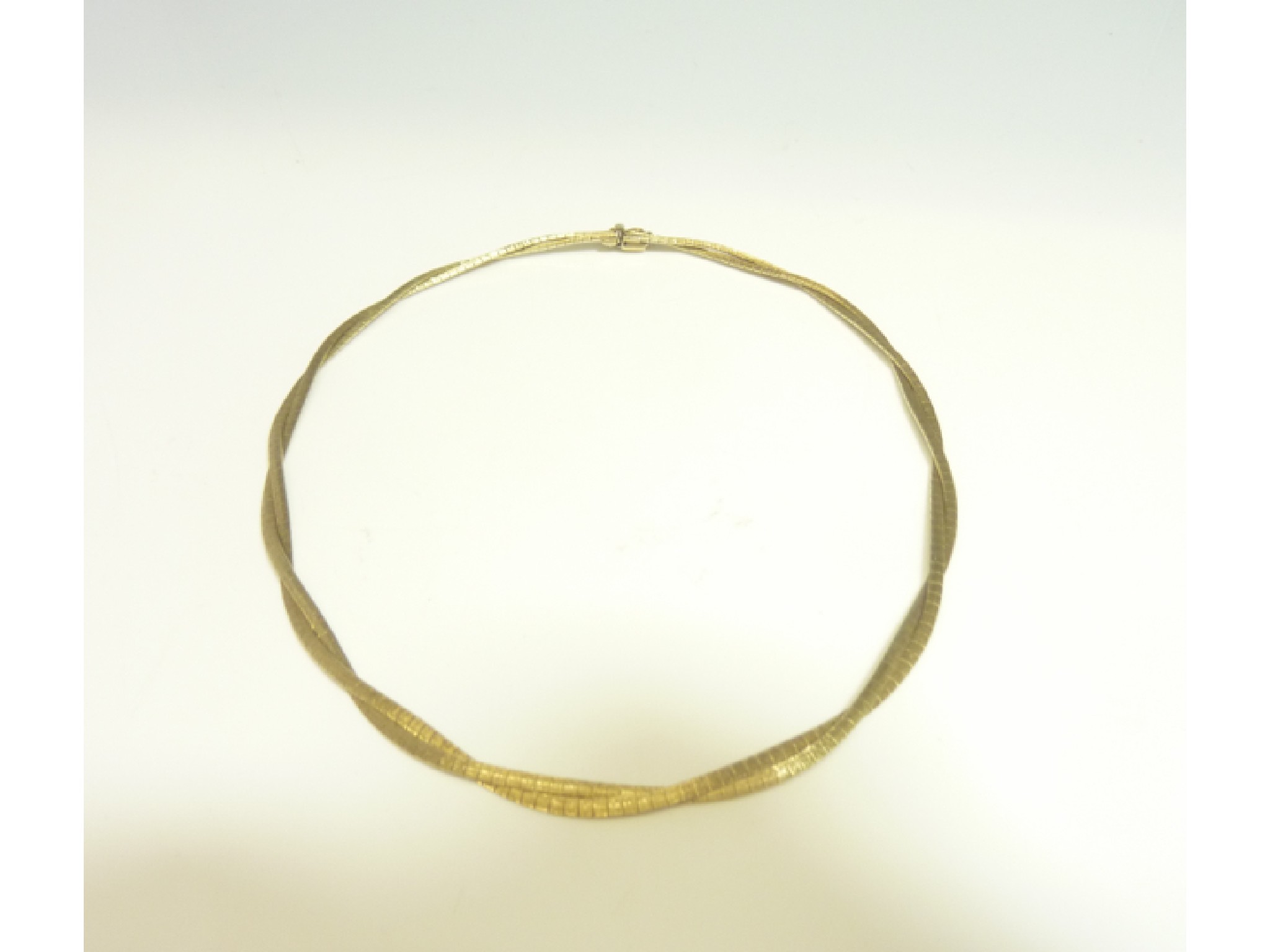 Appraisal: A ct gold two-strand woven necklace composed of textured brick-links