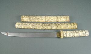 Appraisal: A Japanese Tanto with carved bone sheath and handle carved